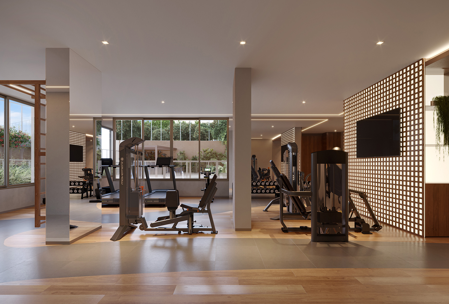 Espaço amplo com diversos equipamentos de musculação, grandes janelas com vista para jardim e parede com TV tela plana.