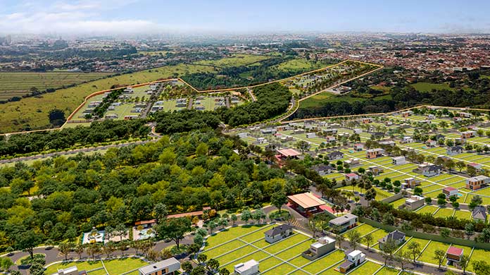 Visão aérea do bairro, apresentando a conexão entre as áreas dos residenciais e o verde abundante da natureza ao redor.