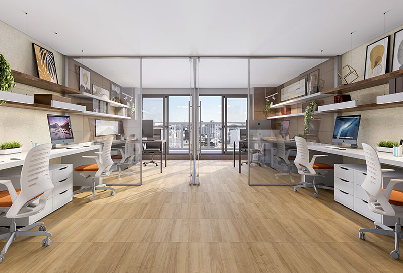 Escritório moderno com estações de trabalho, computadores, divisórias de vidro e vista da cidade ao fundo.
